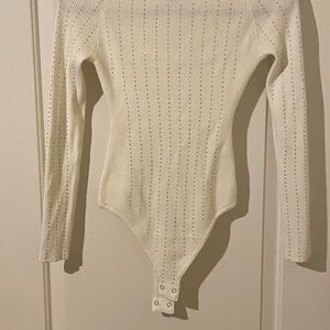Sweet Rain Ivory Ribbed Long-Sleeve Bodysuit with Rhinestones.